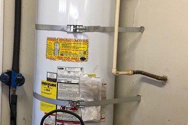 Image: ESS Garage Retrofit - Strapping the Water Heater