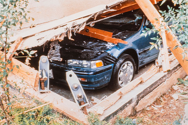 Image: A car damaged from a structure collapse